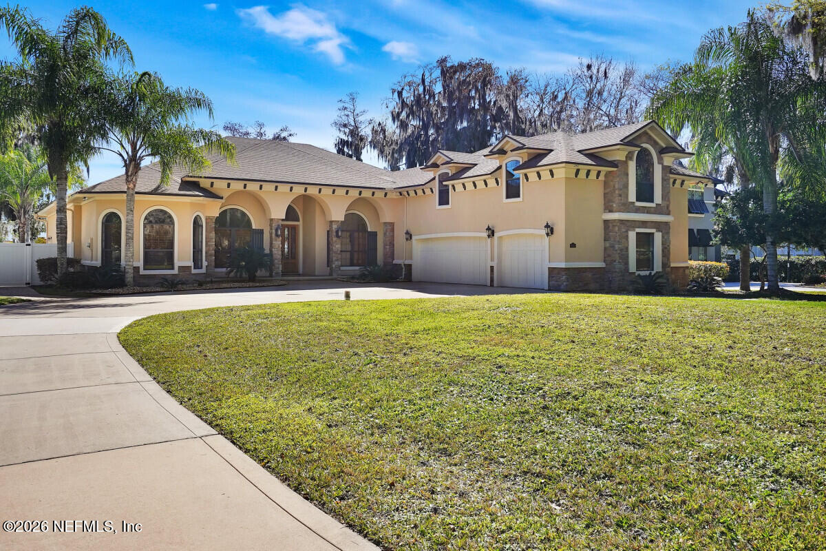 2942 Magnolia Road Orange Park, FL 32065 - Photo 6 of 50 a view of white house with a yard