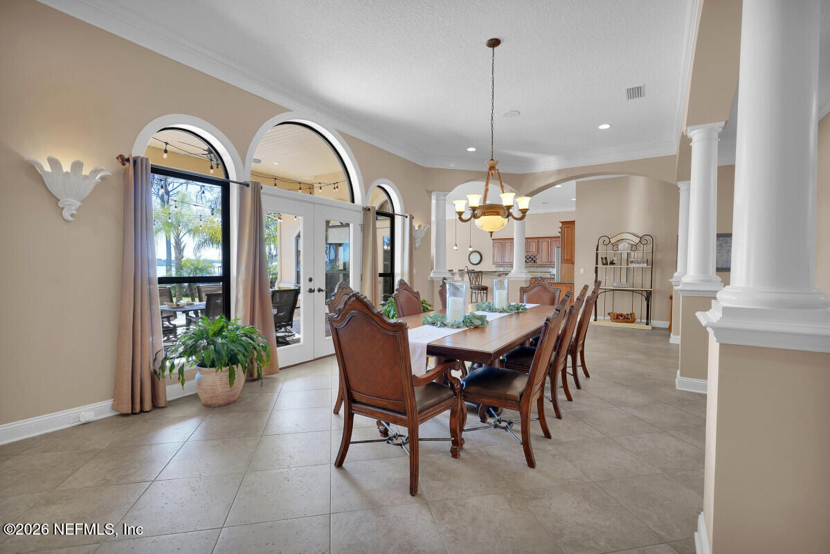 2942 Magnolia Road Orange Park, FL 32065 - Photo 9 of 50 a view of a dining room with furniture and chandelier