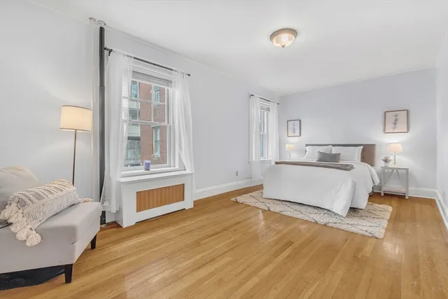 a spacious bedroom with a bed and a couch