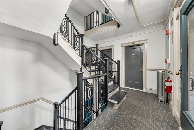 a view of a hallway with stairs