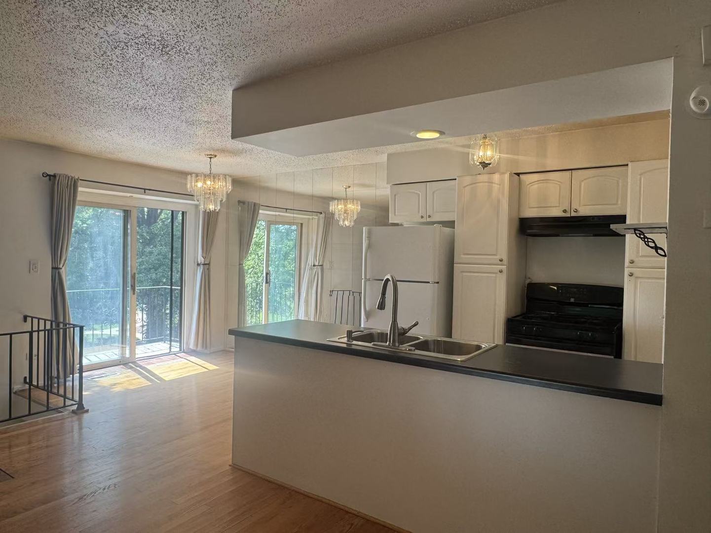1326 Inverrary Lane, Unit 1326 Deerfield, IL 60015 - Photo 2 of 15 a room with a large mirror and glass door