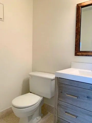 a bathroom with a toilet and a sink