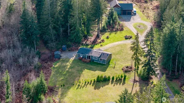 an aerial view of residential house with outdoor space and swimming pool