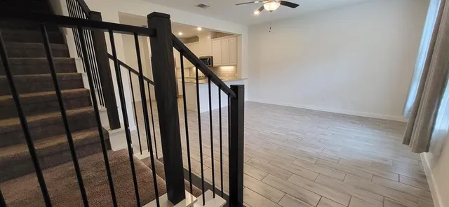 a view of a hallway with a window