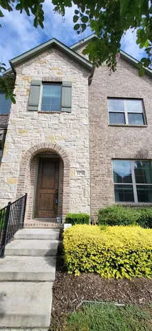 a view of front door of house with yard