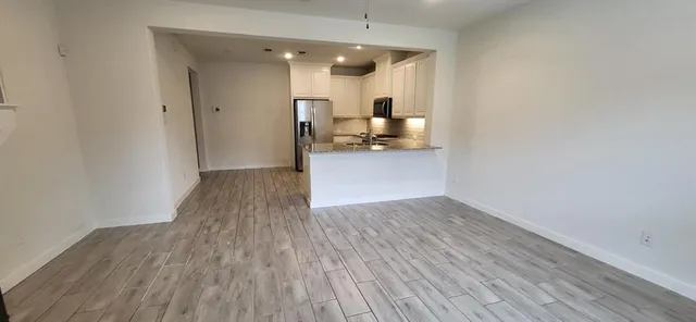 a view of a kitchen from the hallway