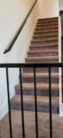a kitchen with granite countertop a refrigerator stove and oven