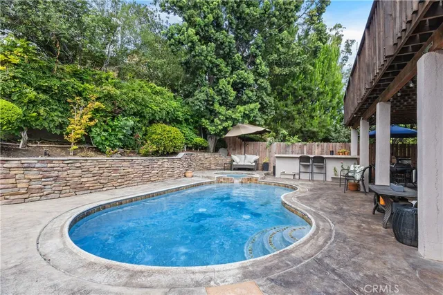 a view of a swimming pool with a patio