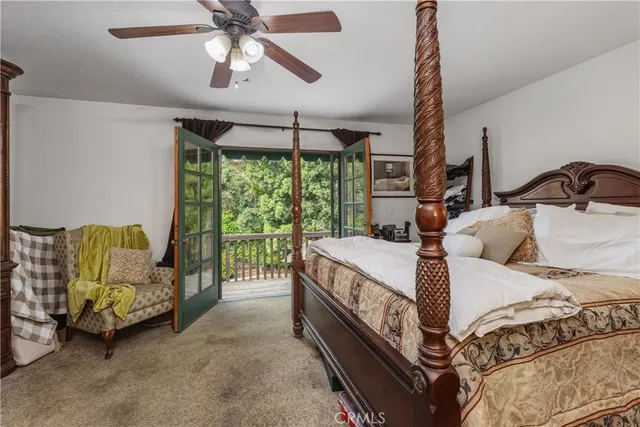 a bed room with a bed and a chandelier