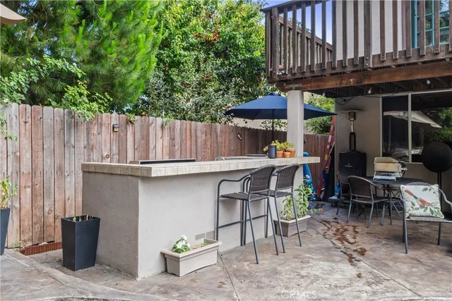 a view of table and chairs in patio
