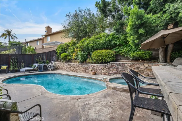 a view of a swimming pool with a patio