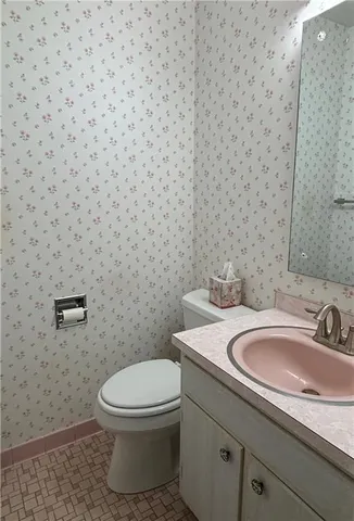 a bathroom with a toilet and a sink