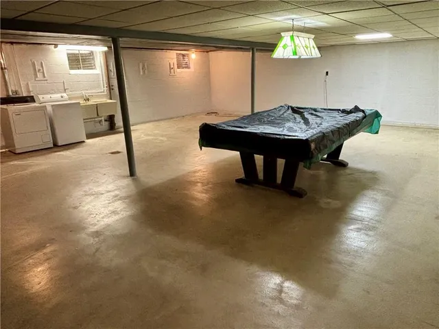 a kitchen with a table and chairs in it