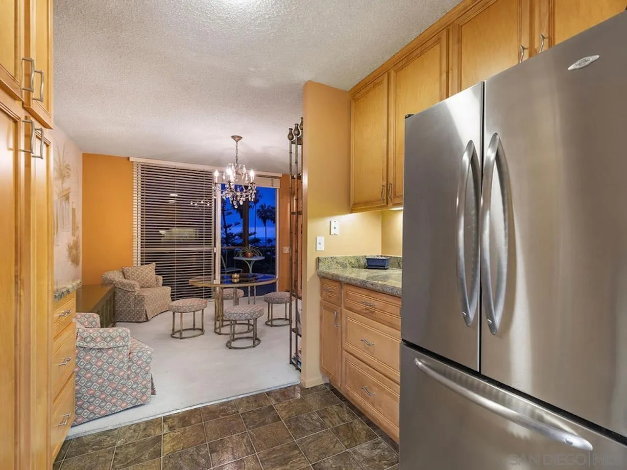 800 Prospect Street, Unit 4A La Jolla, CA 92037 - Photo 21 of 34 a kitchen with stainless steel appliances granite countertop a refrigerator and a stove