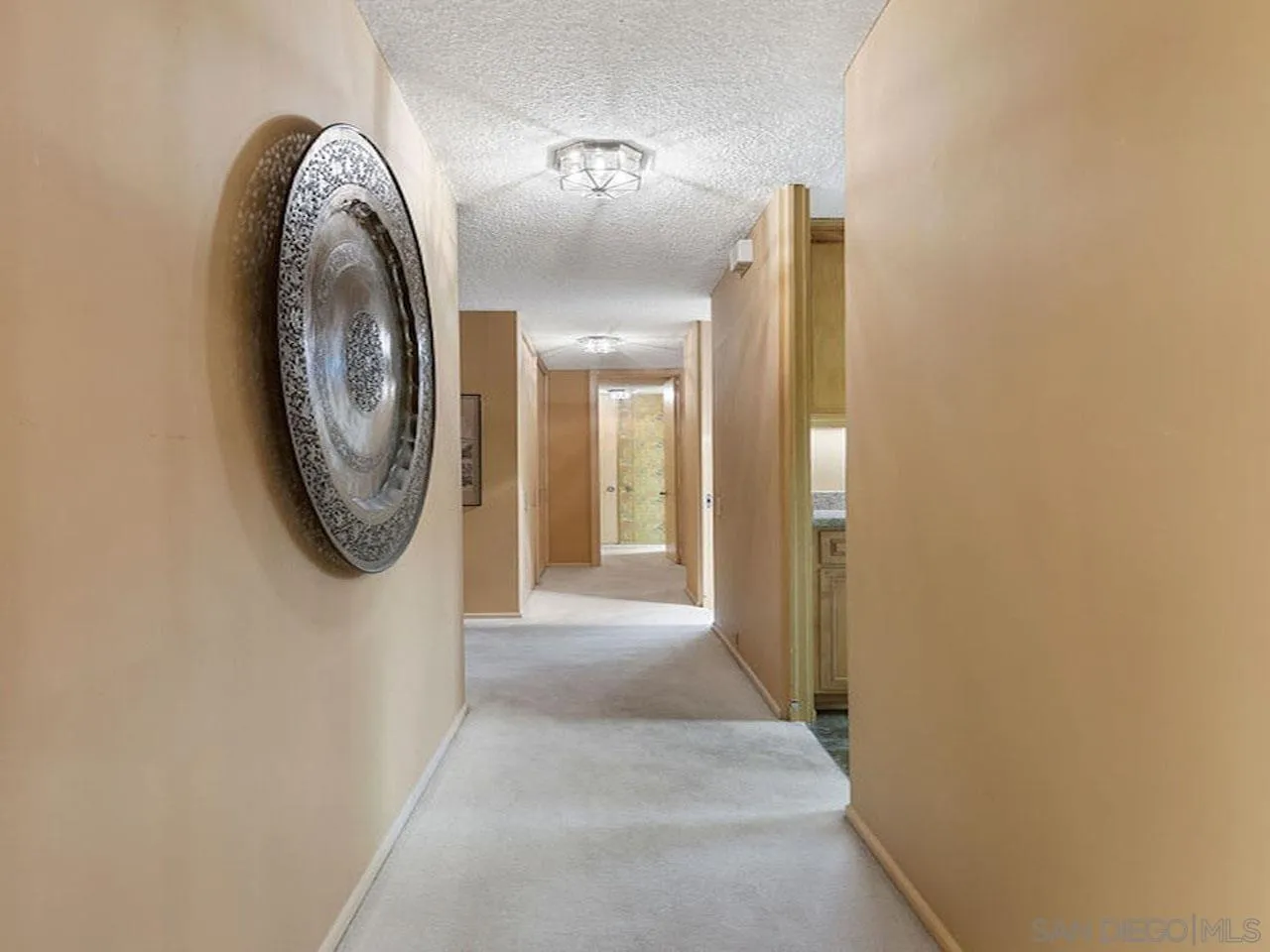 800 Prospect Street, Unit 4A La Jolla, CA 92037 - Photo 25 of 34 a view of a hallway with washer and dryer