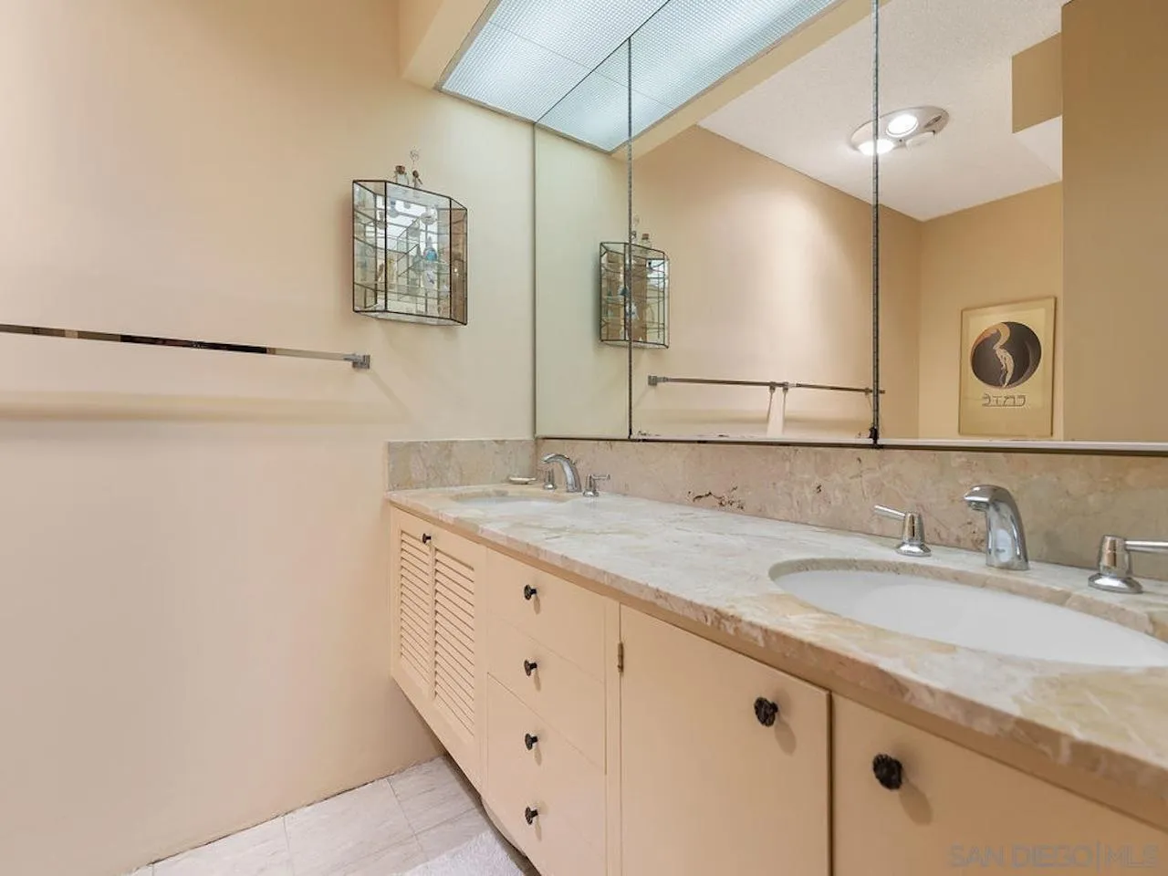 800 Prospect Street, Unit 4A La Jolla, CA 92037 - Photo 33 of 34 a bathroom with a granite countertop sink and a mirror