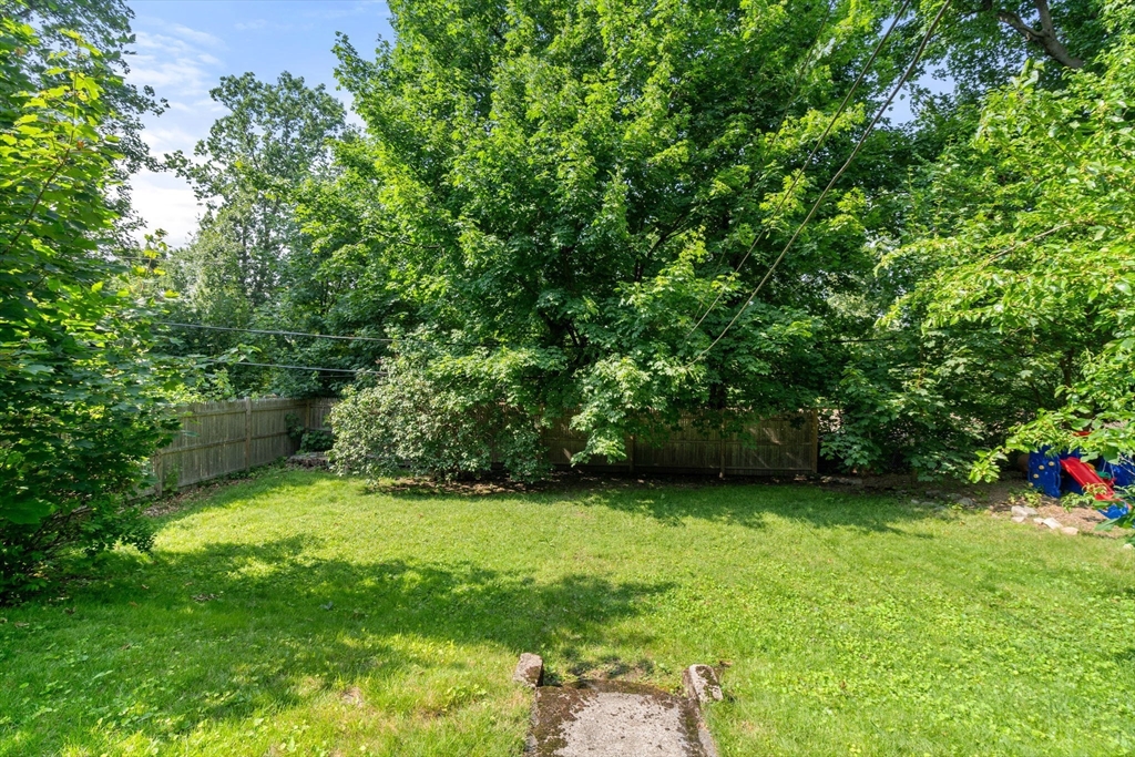 103 Belgrade Avenue, Unit 2 Boston, MA 02131 - Photo 19 of 24 a view of an outdoor space and a yard