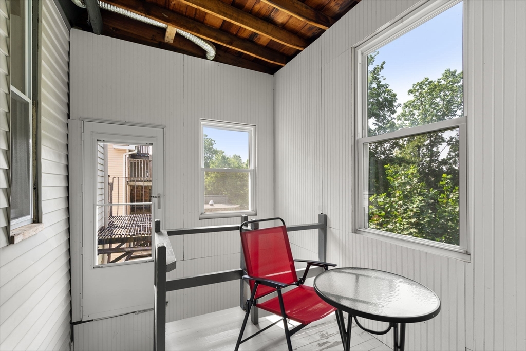 103 Belgrade Avenue, Unit 2 Boston, MA 02131 - Photo 9 of 24 a view of a dining room with furniture window and outside view