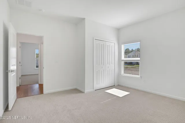 an empty room with windows