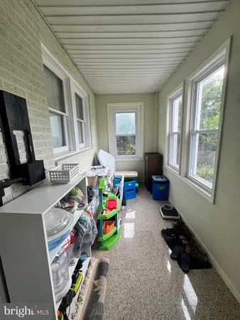 a bed room with furniture and a window