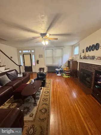 a large room with lots of chairs and wooden floor