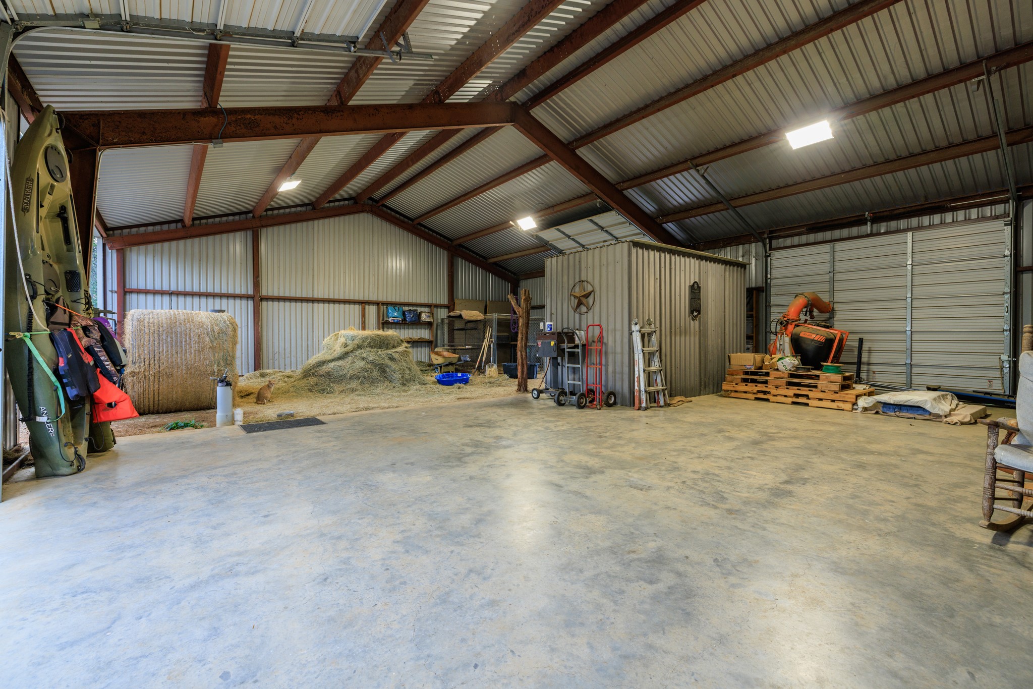 3724 Ranch Road 3347 Round Mountain, TX 78663 - Photo 27 of 40 a view of a garage with storage