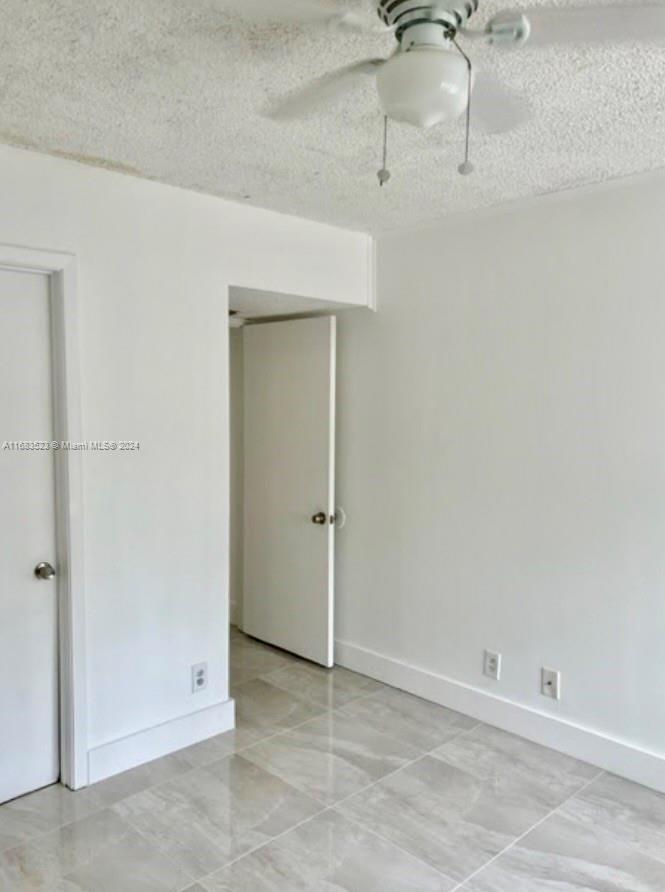 5720 Rock Island Road, Unit 385 Tamarac, FL 33319 - Photo 3 of 9 an empty room