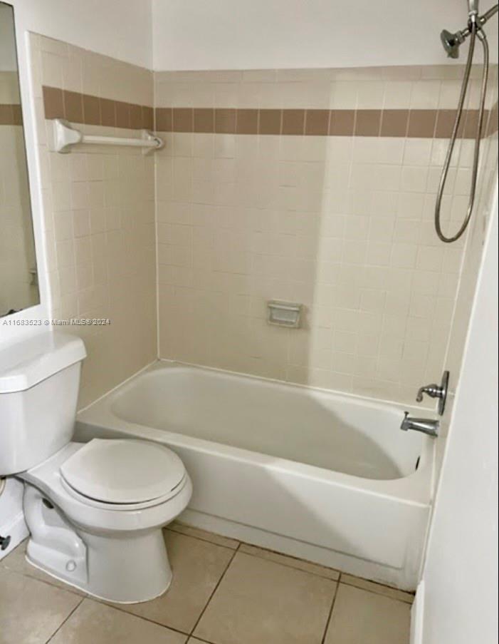 5720 Rock Island Road, Unit 385 Tamarac, FL 33319 - Photo 5 of 9 a bathroom with a toilet and a shower