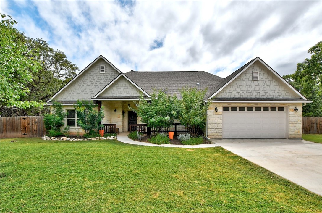 303 Valley Spring Road Wimberley, TX 78676 - Photo 1 of 1 The beautiful front yard and long driveway leading to the 2-car garage at 303 West Valley Spring Road!