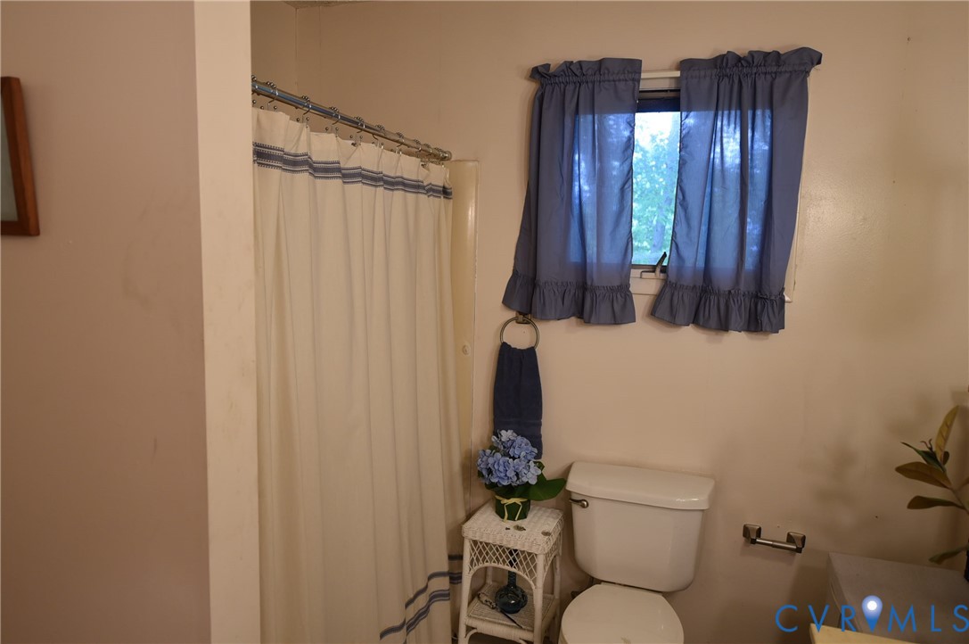 642 Star Street Pounding Mill, VA 24637 - Photo 14 of 20 Bathroom featuring a shower with a shower curtain