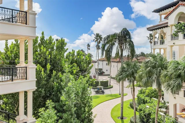a house with palm tree in front of it