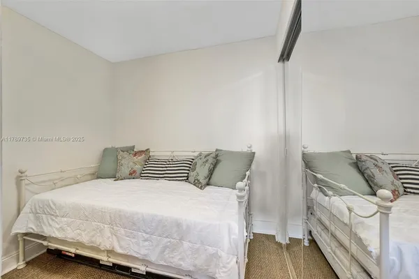 a bedroom with a bed and with furniture
