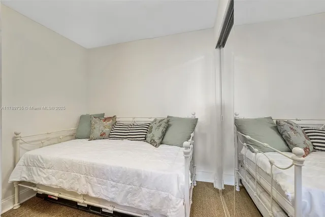 a bedroom with a bed and with furniture