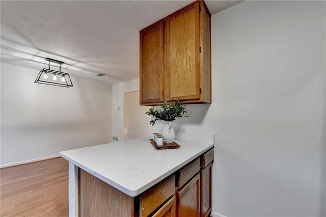 a room with a sink and cabinets