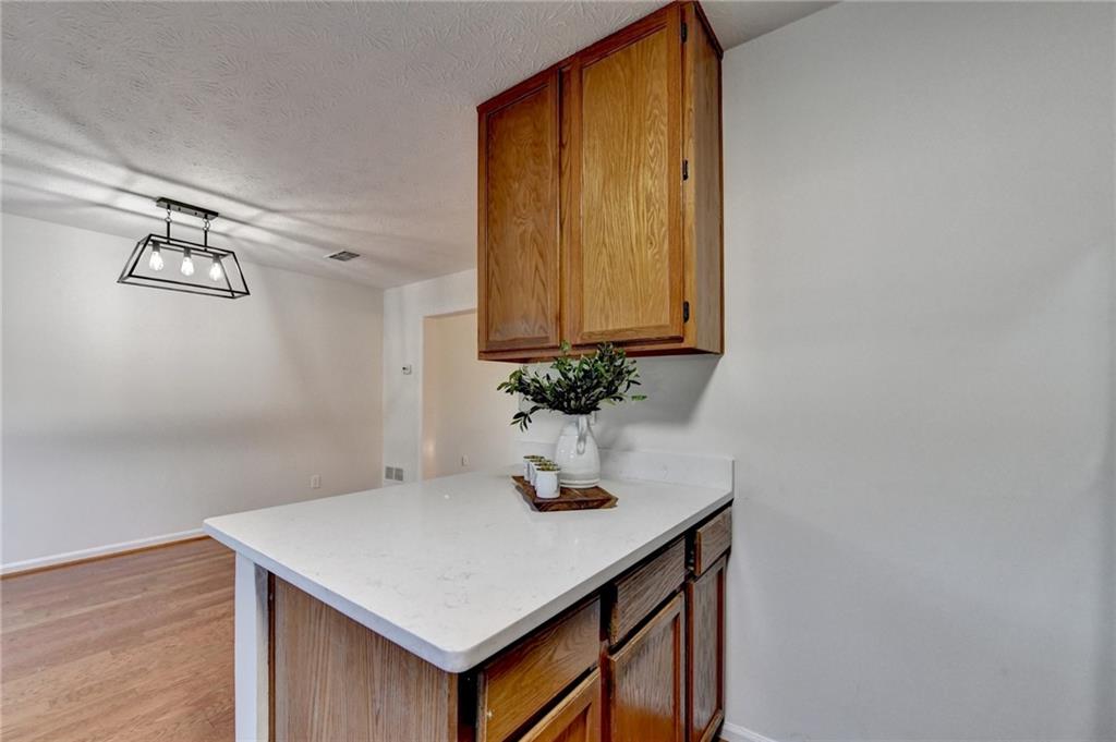 3492 Tulip Tree Lane Duluth, GA 30096 - Photo 12 of 35 a room with a sink and cabinets