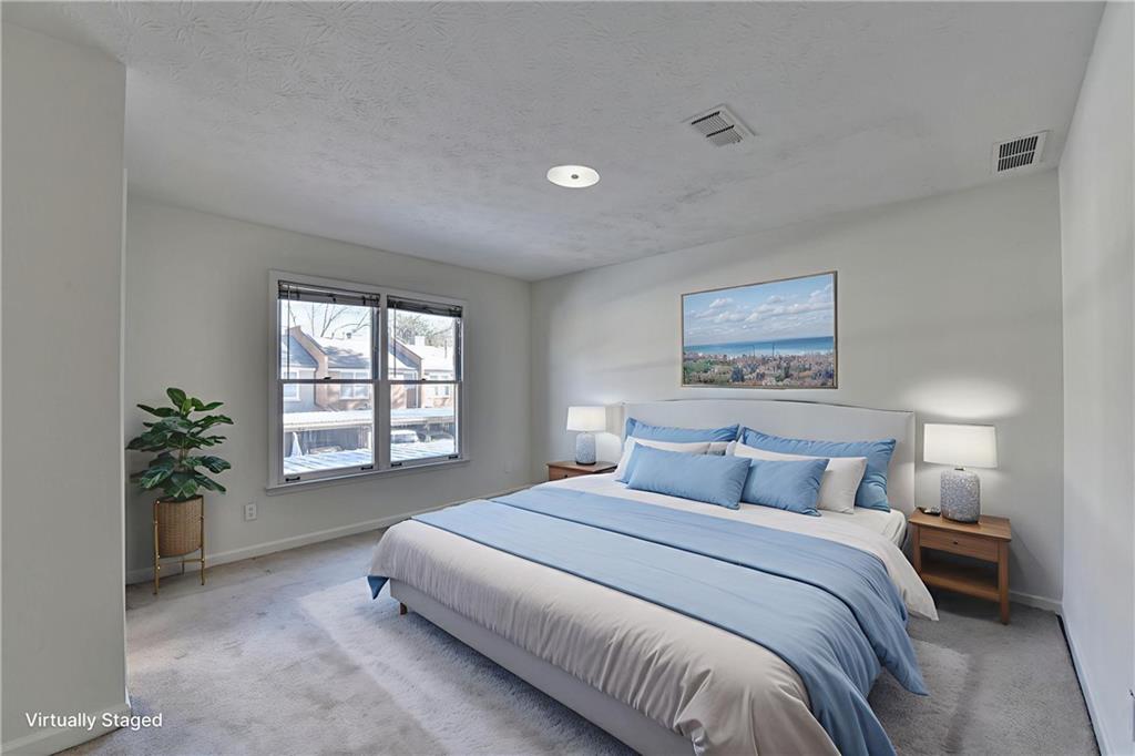 3492 Tulip Tree Lane Duluth, GA 30096 - Photo 15 of 35 a bedroom with a large bed and a potted plant