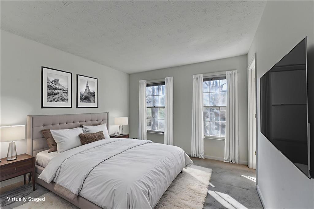 3492 Tulip Tree Lane Duluth, GA 30096 - Photo 19 of 35 a bedroom with a large bed and a window