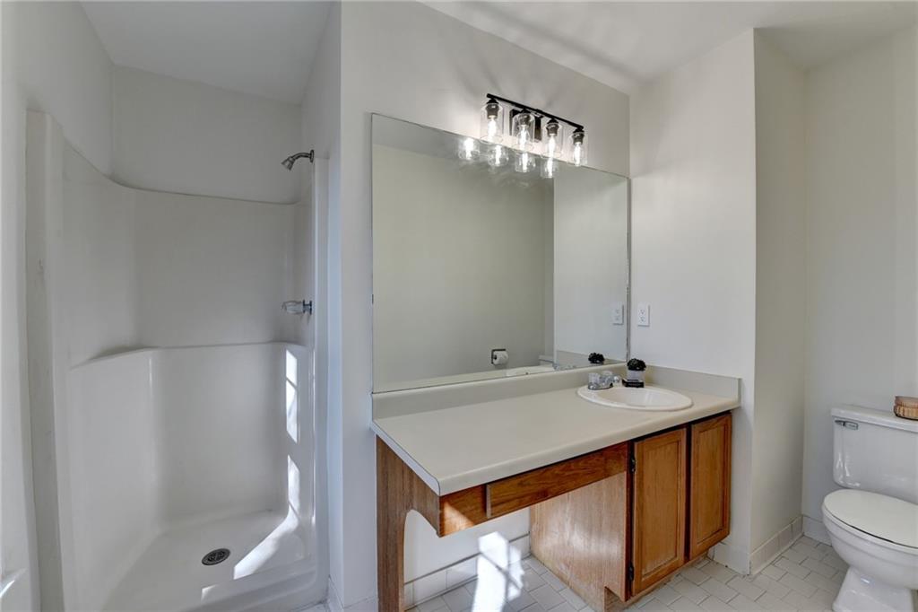 3492 Tulip Tree Lane Duluth, GA 30096 - Photo 20 of 35 a bathroom with a sink a toilet and shower