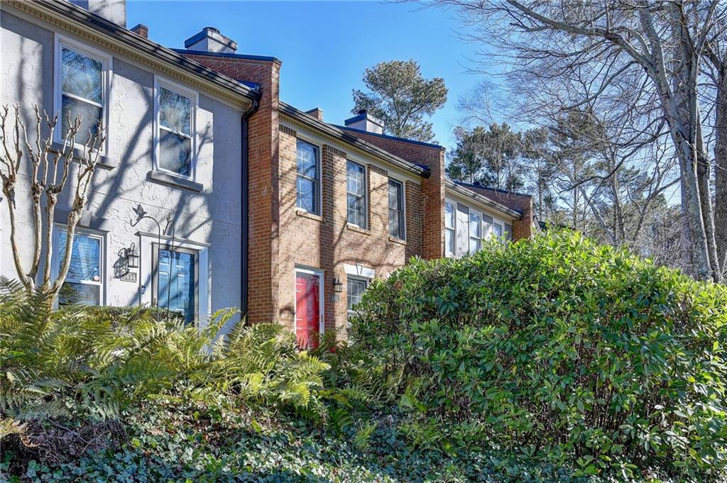 3492 Tulip Tree Lane Duluth, GA 30096 - Photo 2 of 35 a front view of a house with garden