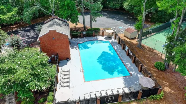 an aerial view of a house with outdoor space