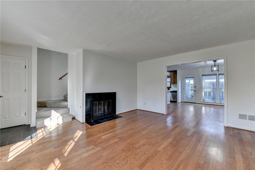 3492 Tulip Tree Lane Duluth, GA 30096 - Photo 29 of 35 a view of an empty room with wooden floor and a window