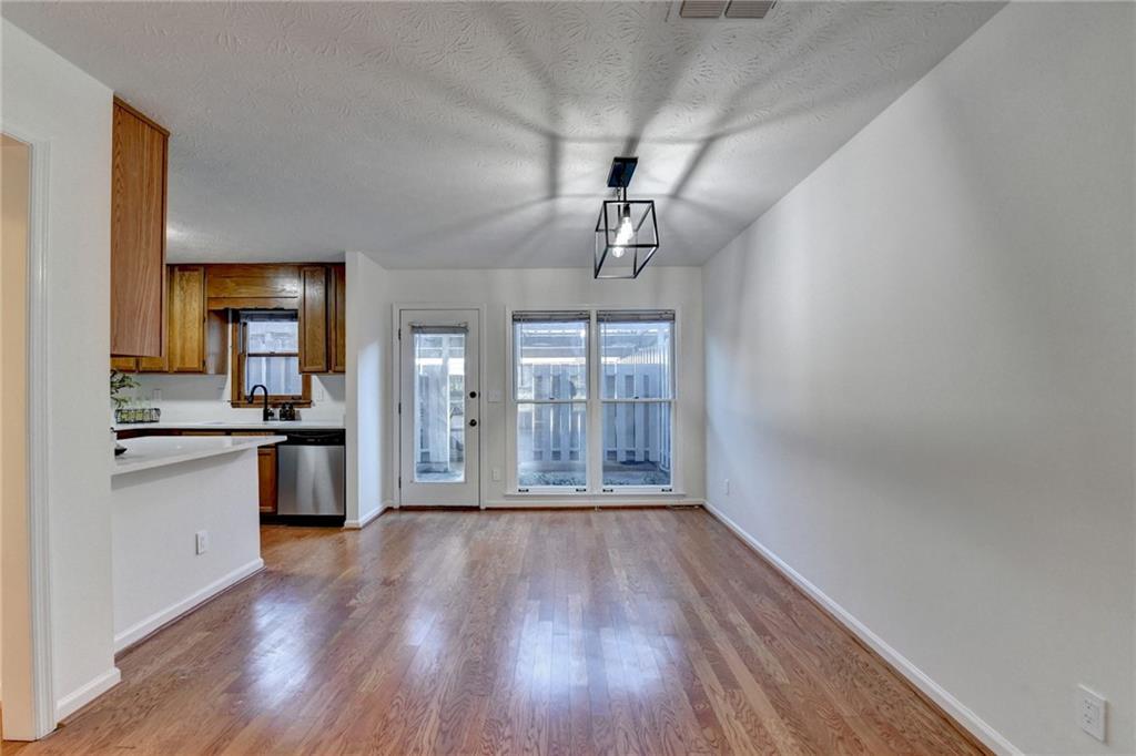 3492 Tulip Tree Lane Duluth, GA 30096 - Photo 31 of 35 a view of a kitchen with a sink wooden floor and a window
