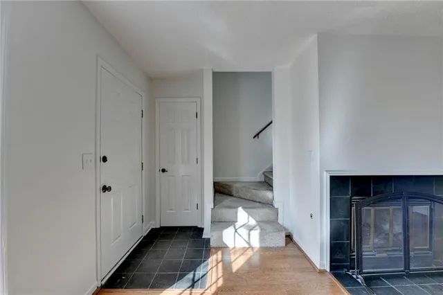 a view of a livingroom with wooden floor and cabinet