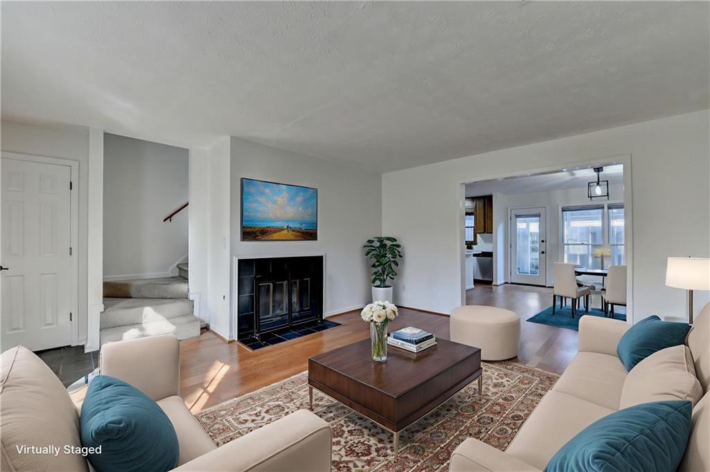 3492 Tulip Tree Lane Duluth, GA 30096 - Photo 6 of 35 a living room with furniture and a fireplace
