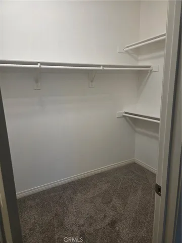 a white toilet sitting next to a shower