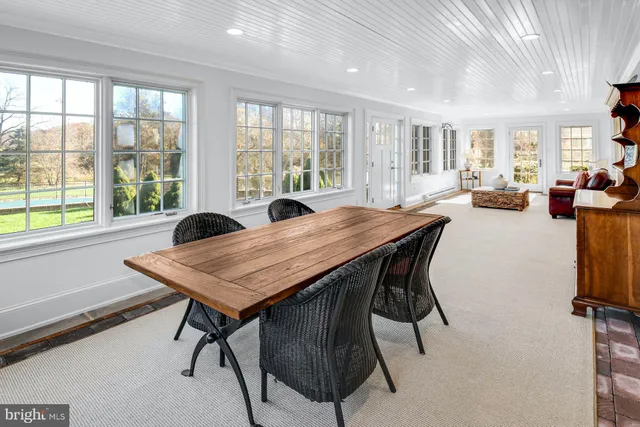 a view of a dining room with furniture window and outside view