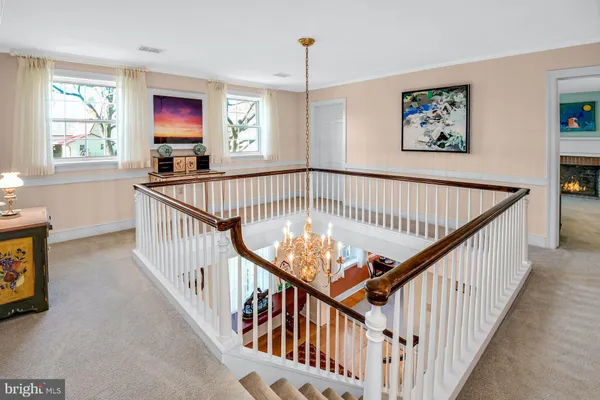 a view of staircase with wooden floor and window