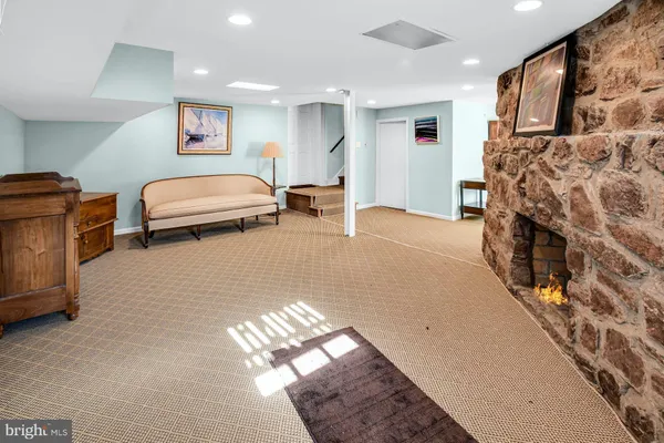 a bedroom with furniture and a fireplace