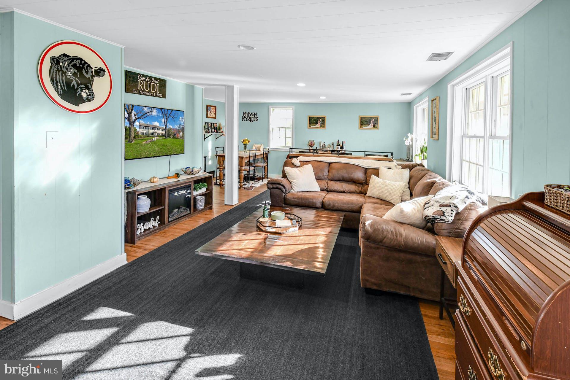 1315 Pineville Road New Hope, PA 18938 - Photo 28 of 51 a living room with furniture a window and a clock