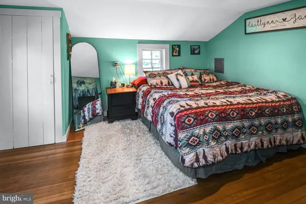 a bedroom with a bed and window